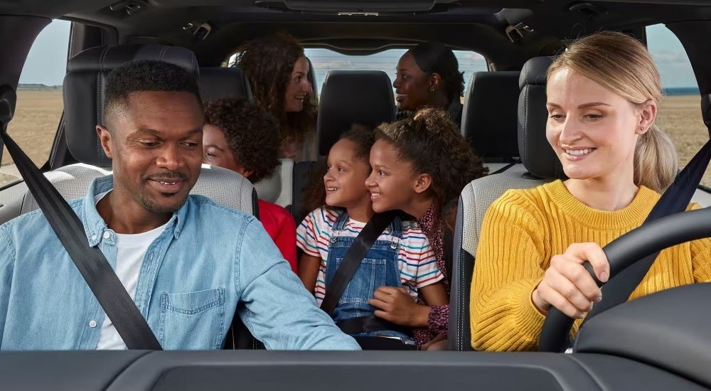 Car Dealership - 2023 Land Rover Discovery - People.jpg People are shown driving in a 2023 Land Rover Discovery.