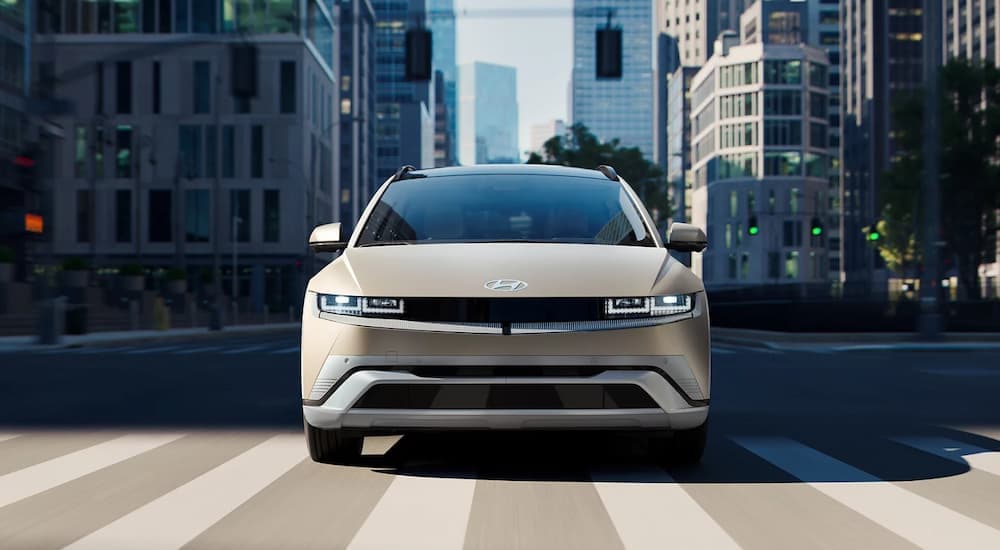 Grey 2025 Hyundai IONIQ 6 for sale near Mount Pleasant driving on a city street
