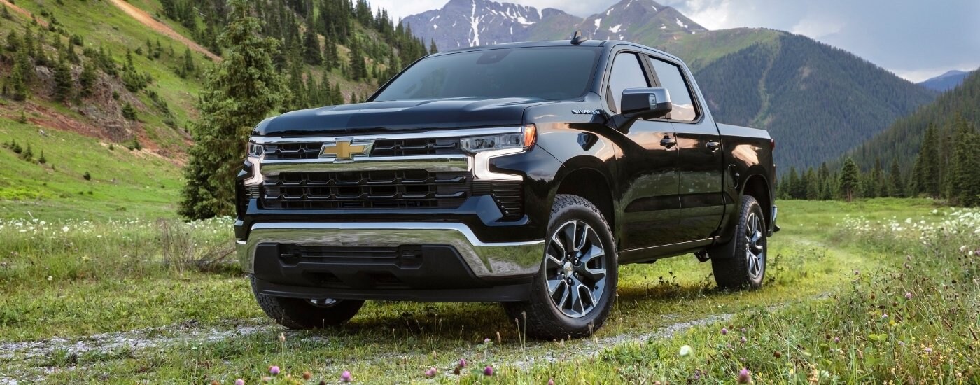 A black 2025 Chevy Silverado 1500 from the front at an angle.