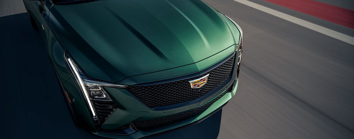 Green 2025 Cadillac CT5-V driving on a track