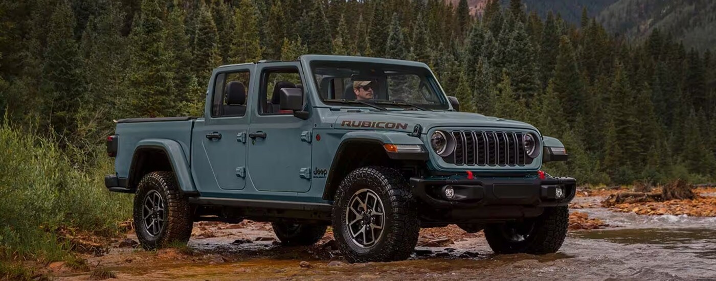 A grey 2024 Jeep Gladiator from the side.