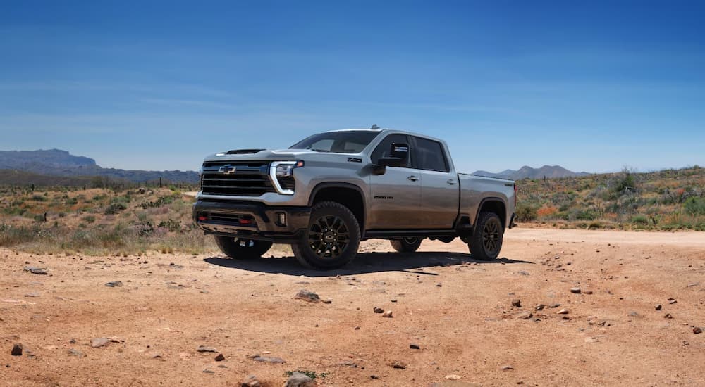 Grey 2025 Chevy Silverado 2500HD Trail Boss parked on dirt