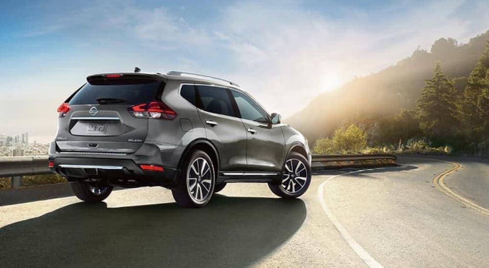A silver 2018 Nissan Rogue is shown parked on a shoulder after visiting a used car dealership near Atlanta.