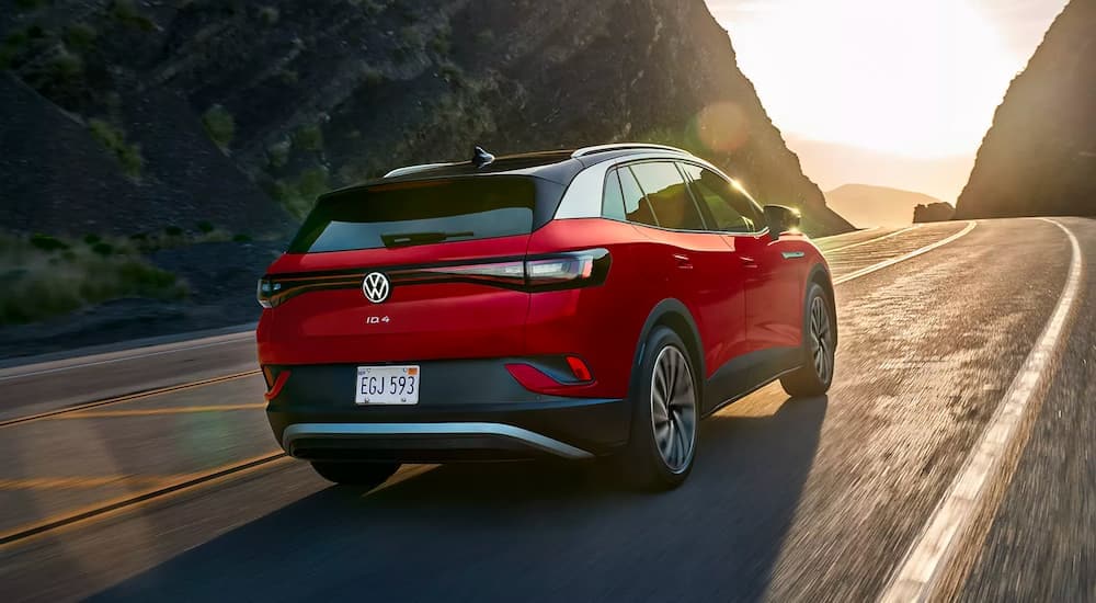 A red 2022 Volkswagen ID.4 is shown rounding a corner.