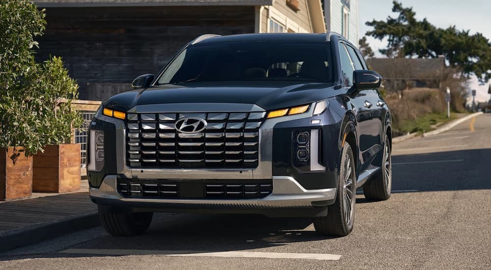 Black 2026 Hyundai Palisade parked near a car dealer near Fayetteville.