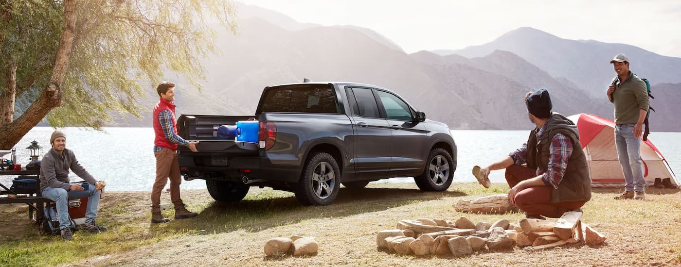 Grey 2025 Honda Ridgeline Trailsport truck for sale in Raleigh at a lake.