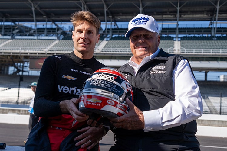 Will Power Gifts Helmet to Rick Hendrick at Indy.jpg