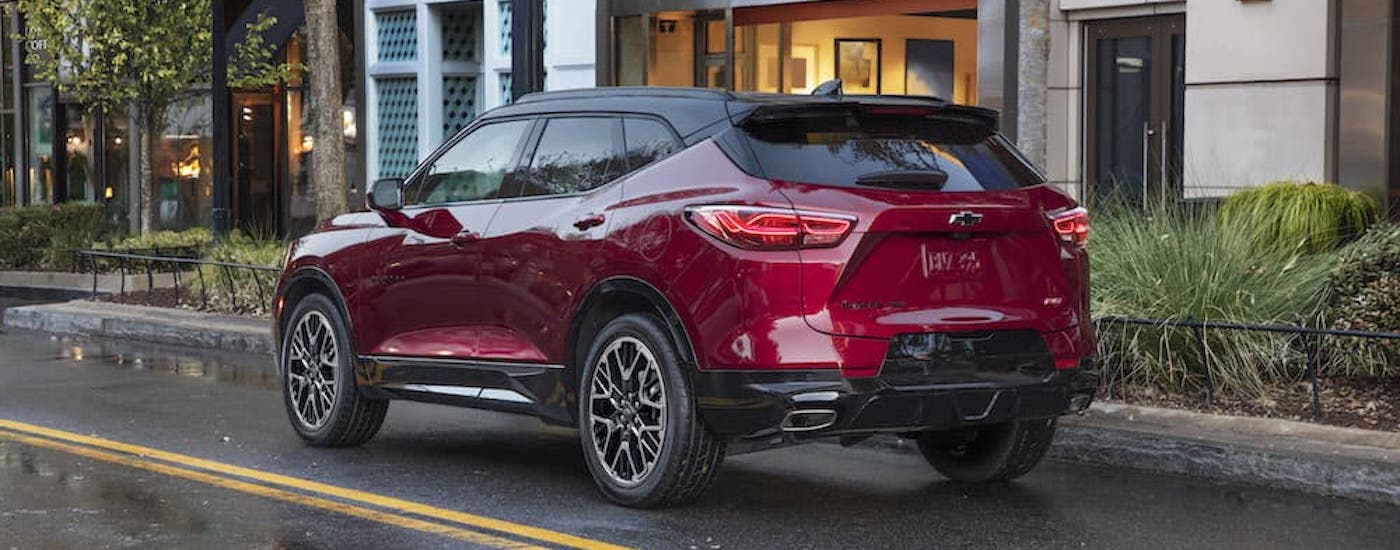 A red 2023 Chevy Blazer RS is shown from the rear at an angle after leaving a car dealer near Cumming.